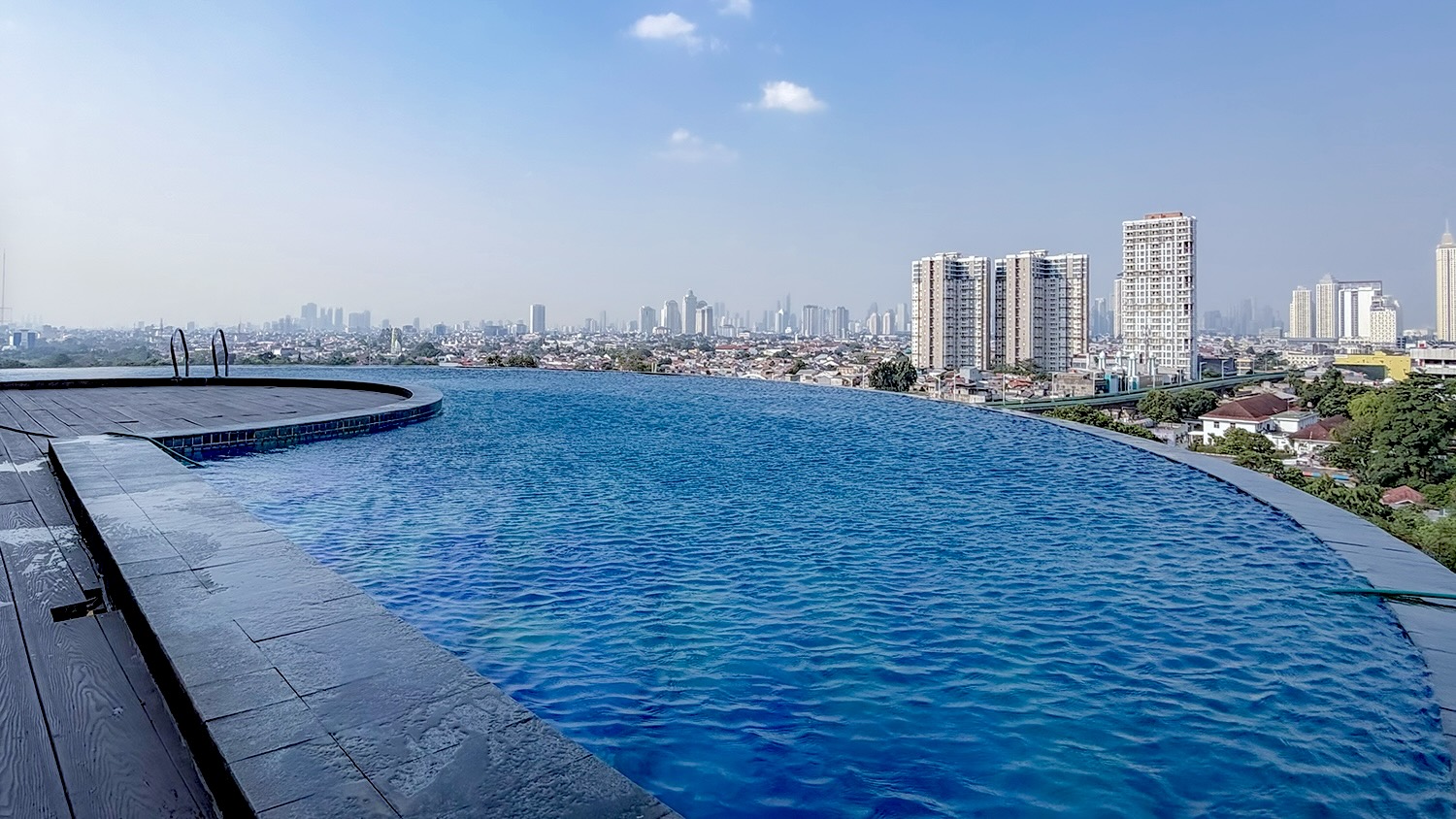The rooftop infinity pool with the city beyond
