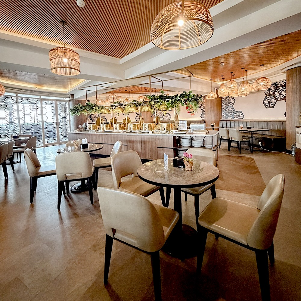 Tables beneath rattan pendant lights